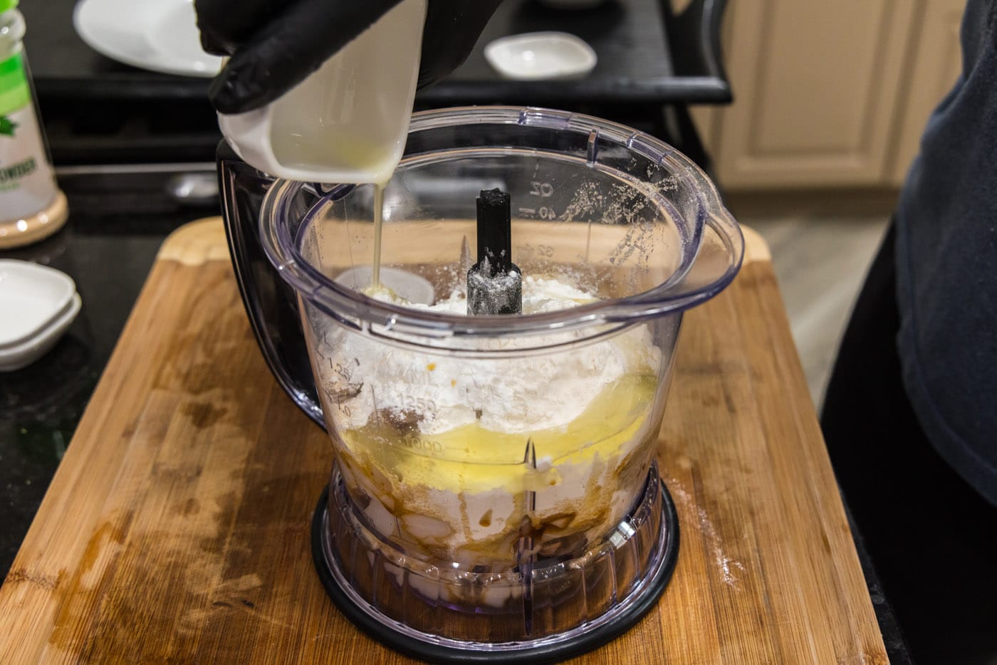 adding fish cake ingredients to a food processor