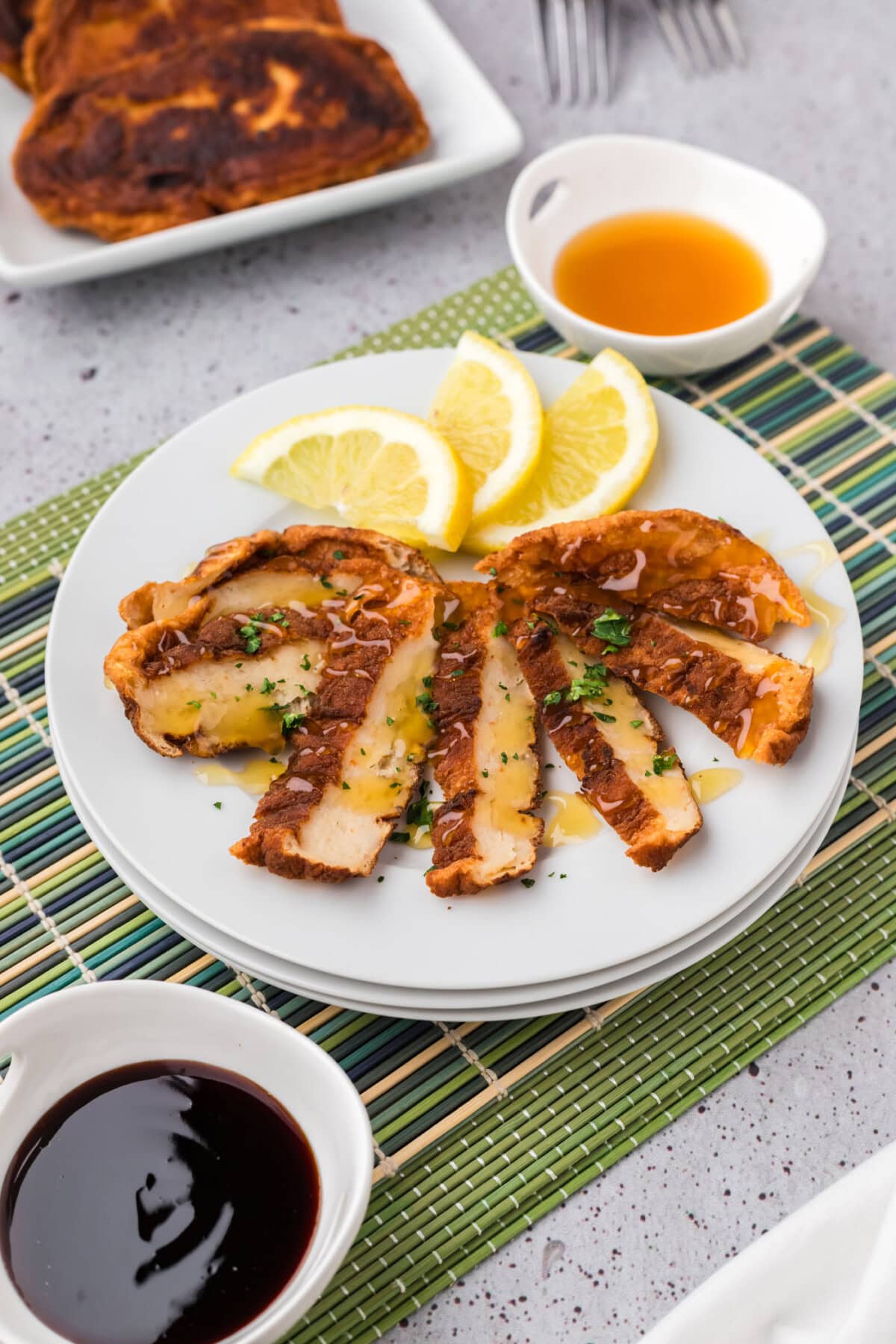 Sliced Korean Fish Cake on a plate with lemon slices
