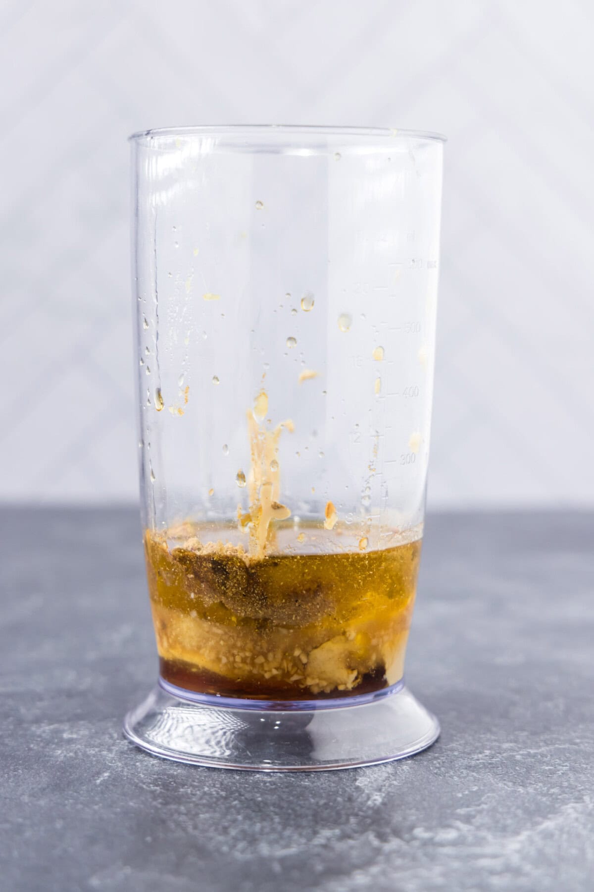 lentil salad dressing ingredients in an immersion blender