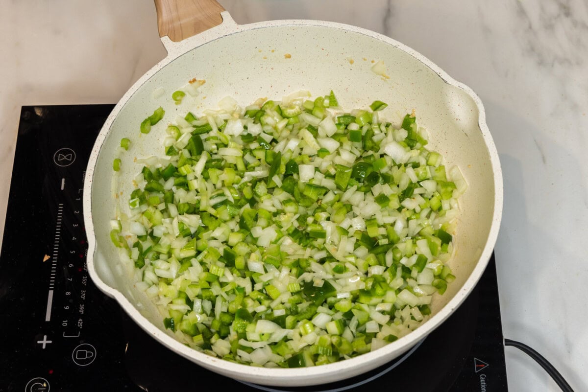 onion, bell pepper, celery, and garlic in a skillet