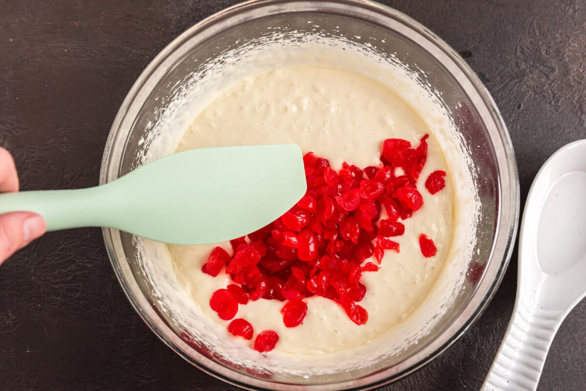 folding chopped maraschino cherries into cake mix