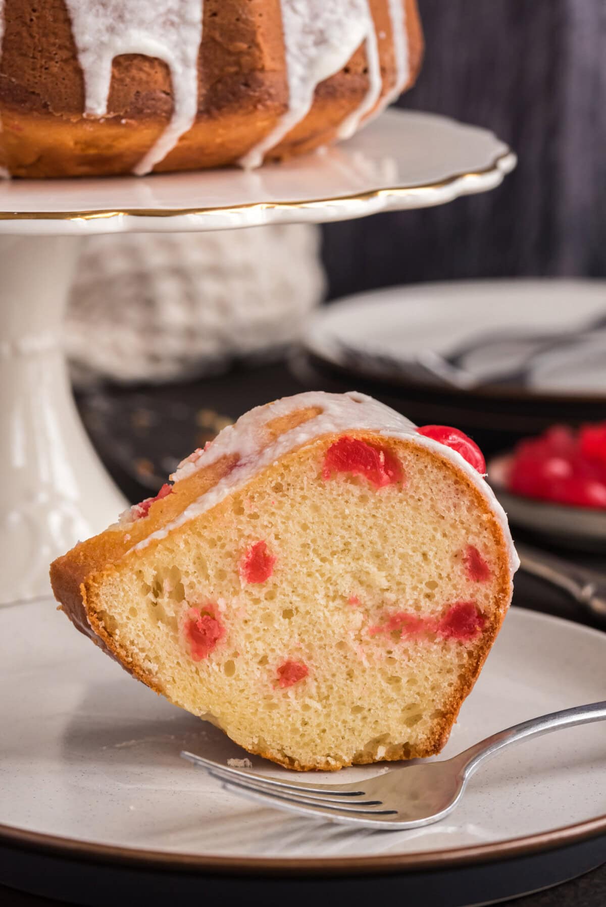 Slice of Maraschino Cherry Bundt Cake on a plate