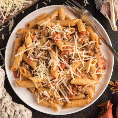 Close up photo of Penne with Tomato Sage Sausage Sauce on a plate