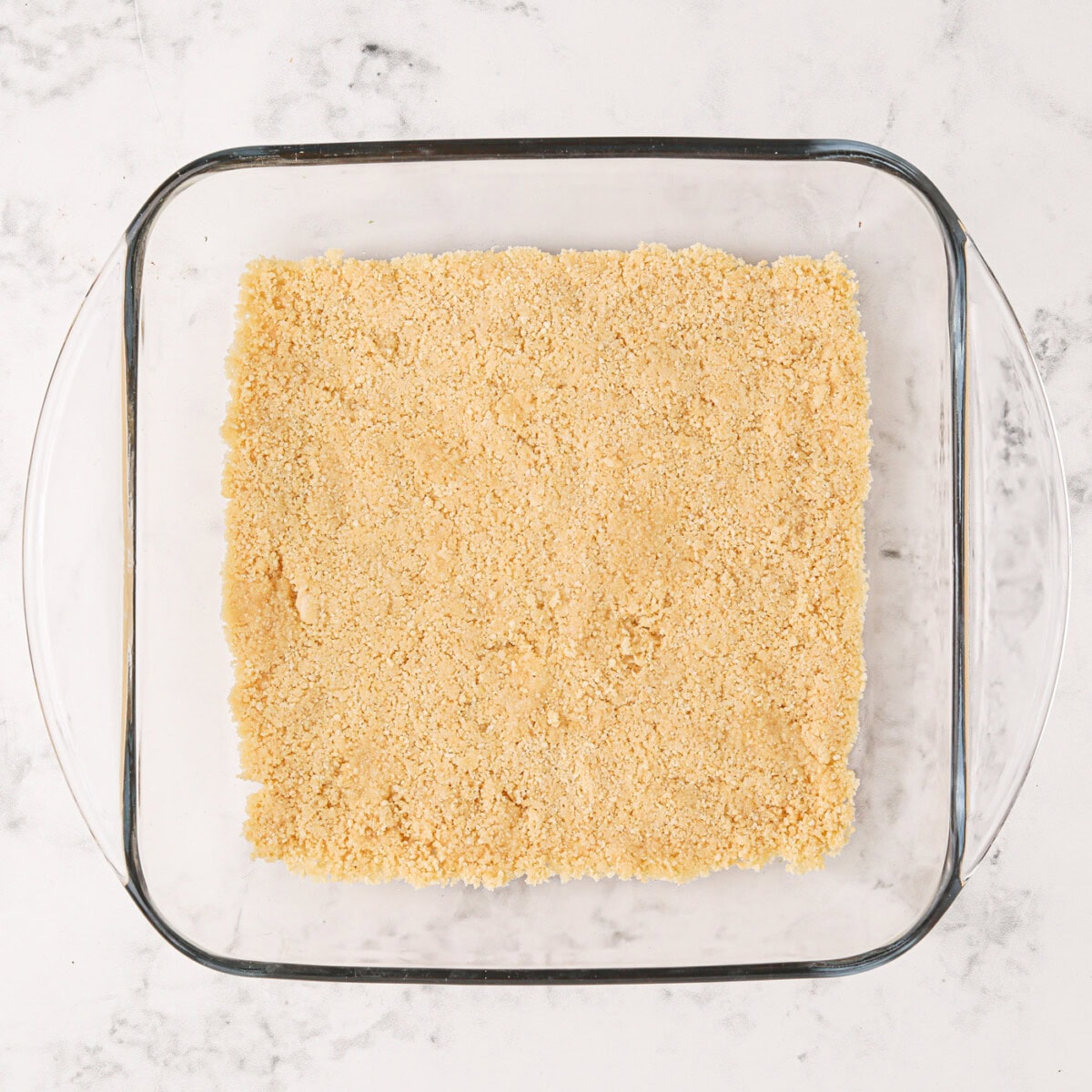 Golden Oreo cookie crust in a pan