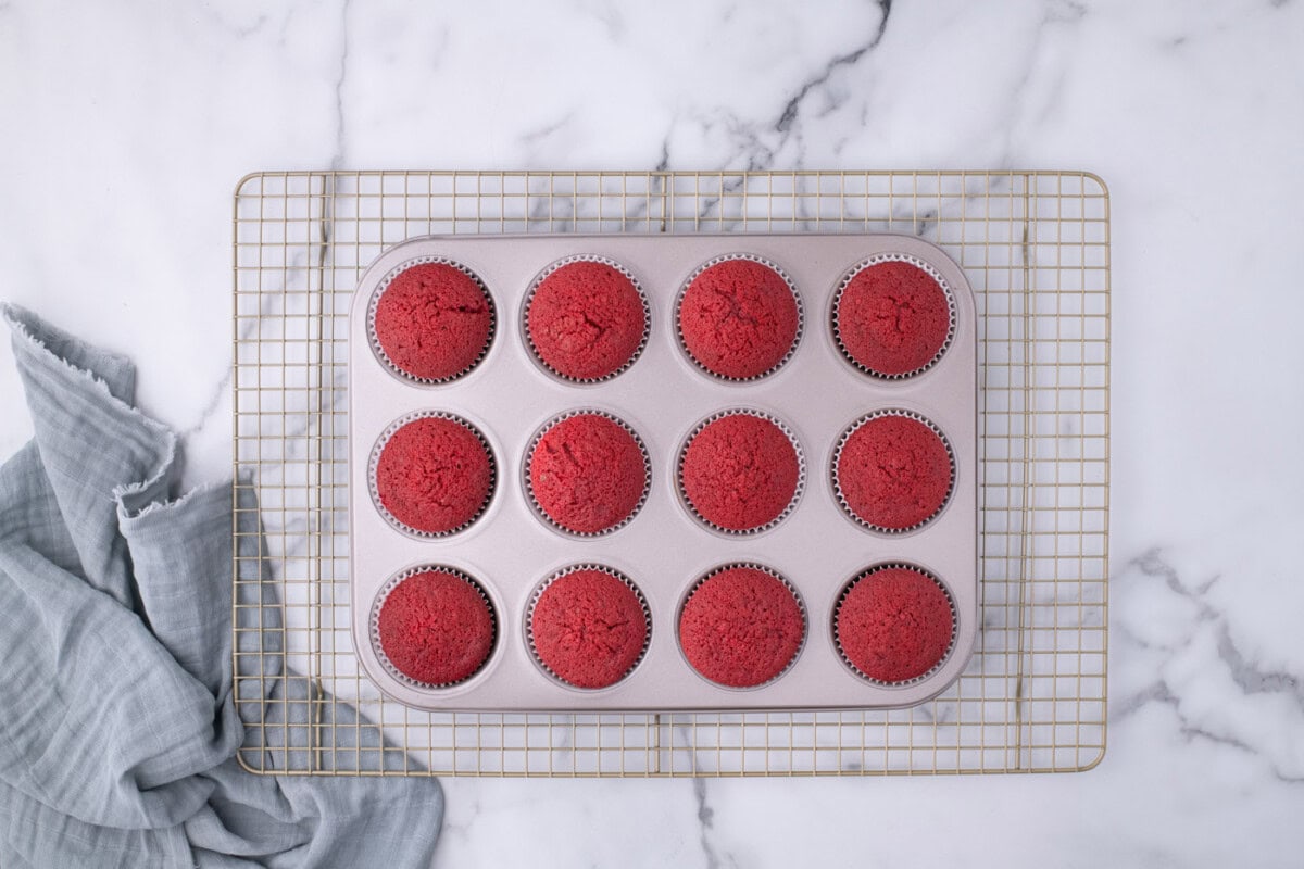 baked red velvet cupcakes in a cupcake tin