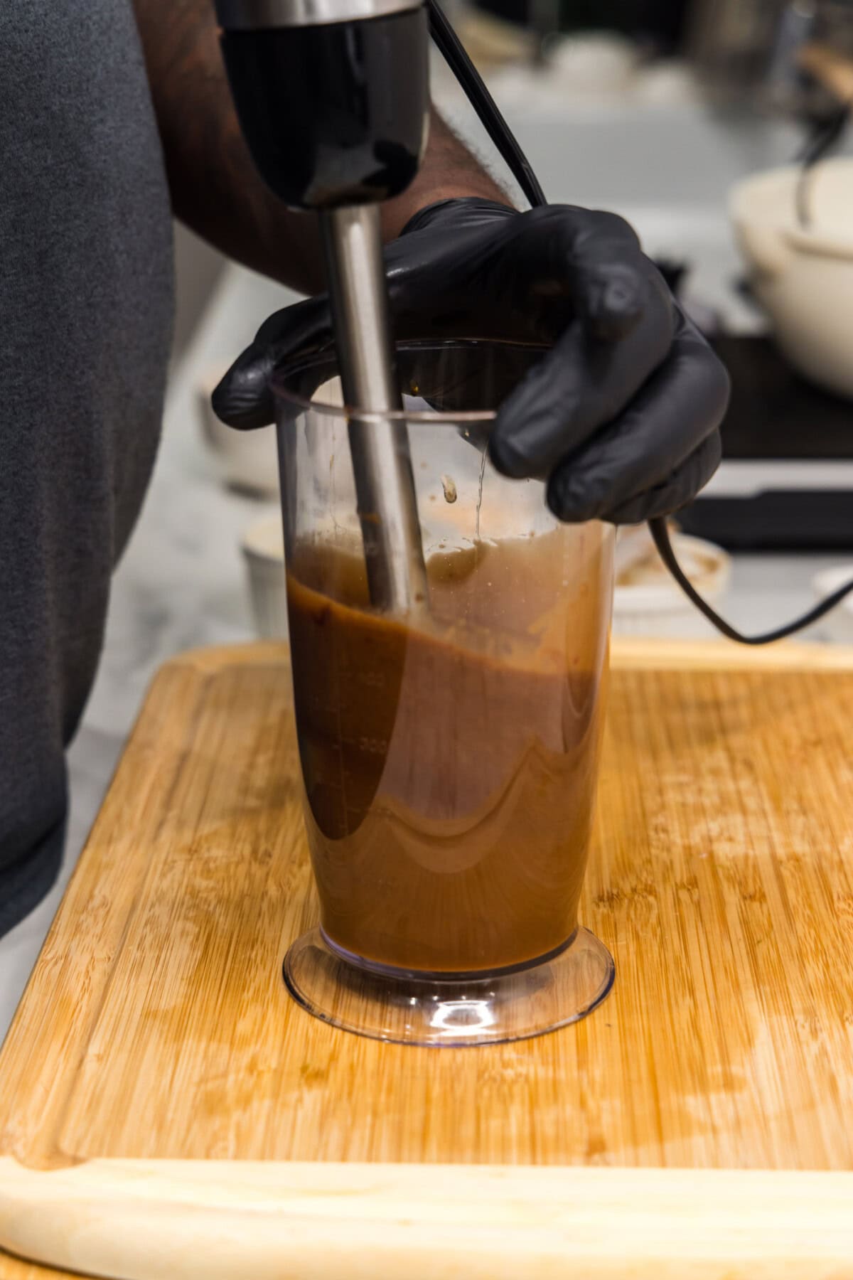 blitzing honey soy sauce marinade in an immersion blender
