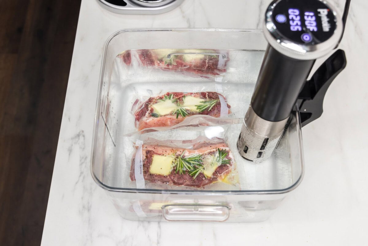 Vaccuum sealed New york strip steaks in sous vide
