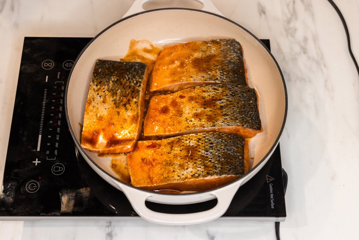 searing salmon skin side up in a skillet