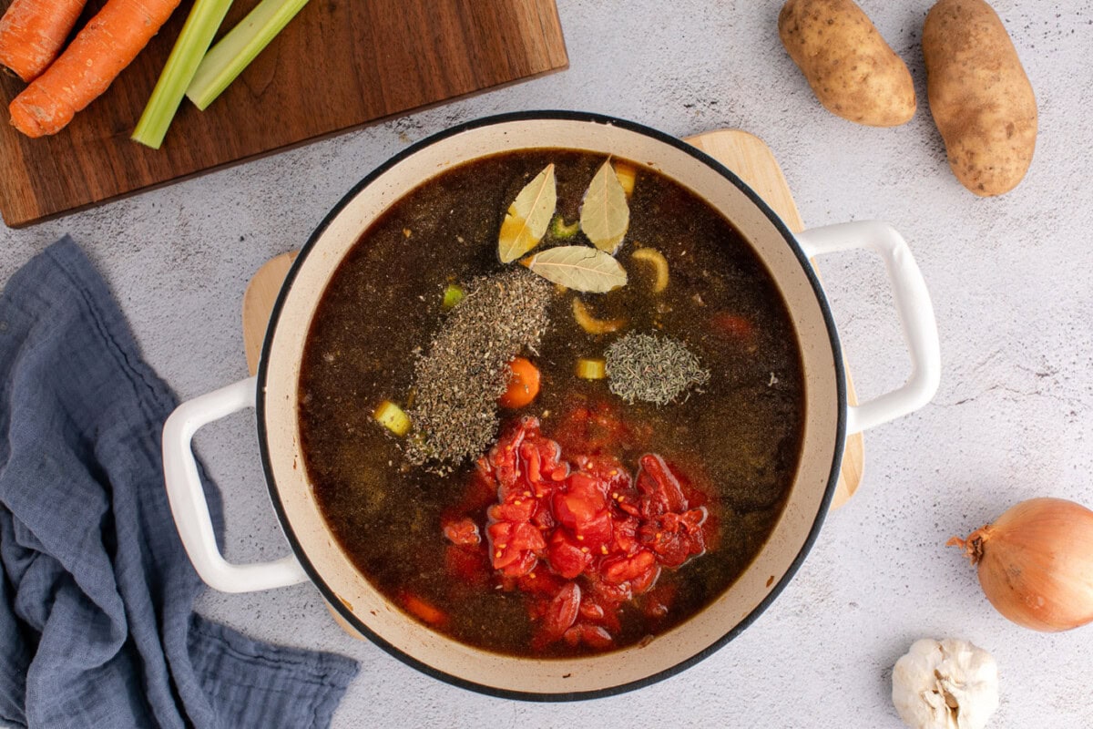 seasonings, beef broth, and diced tomatoes added to vegetable beef soup