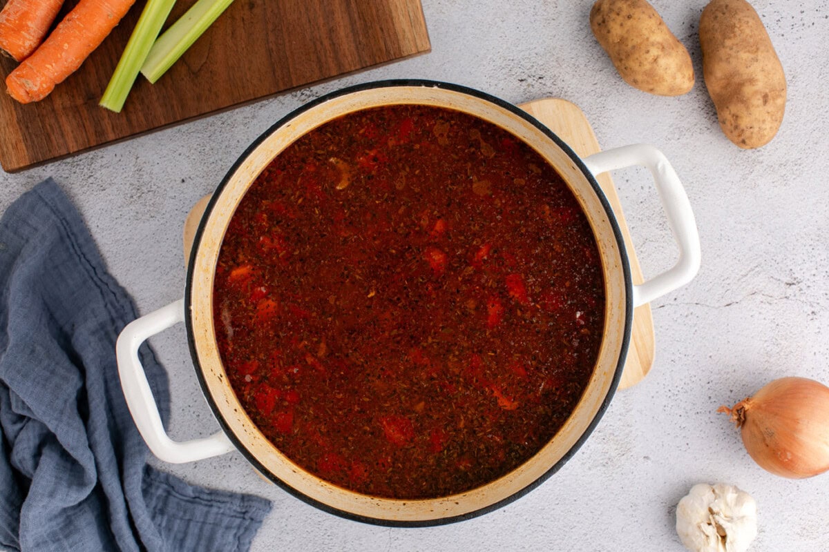 vegetable beef soup in a dutch oven