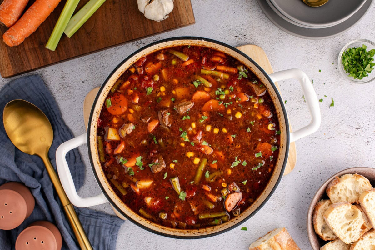 overhead of finished beef vegetable soup in a dutch oven