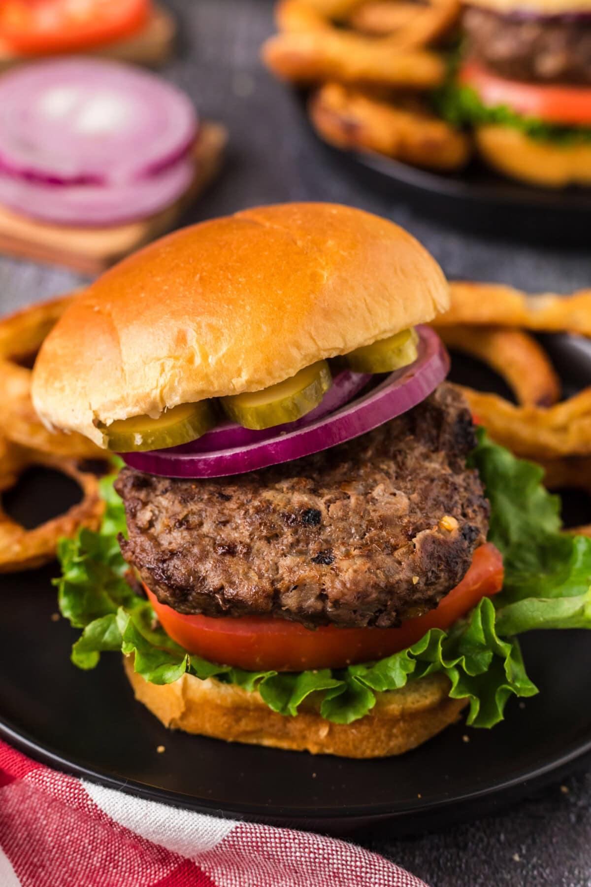 Close up photo of an Air Fryer Burger with the top bun off to the side