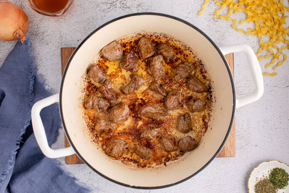 searing beef chunks in a dutch oven