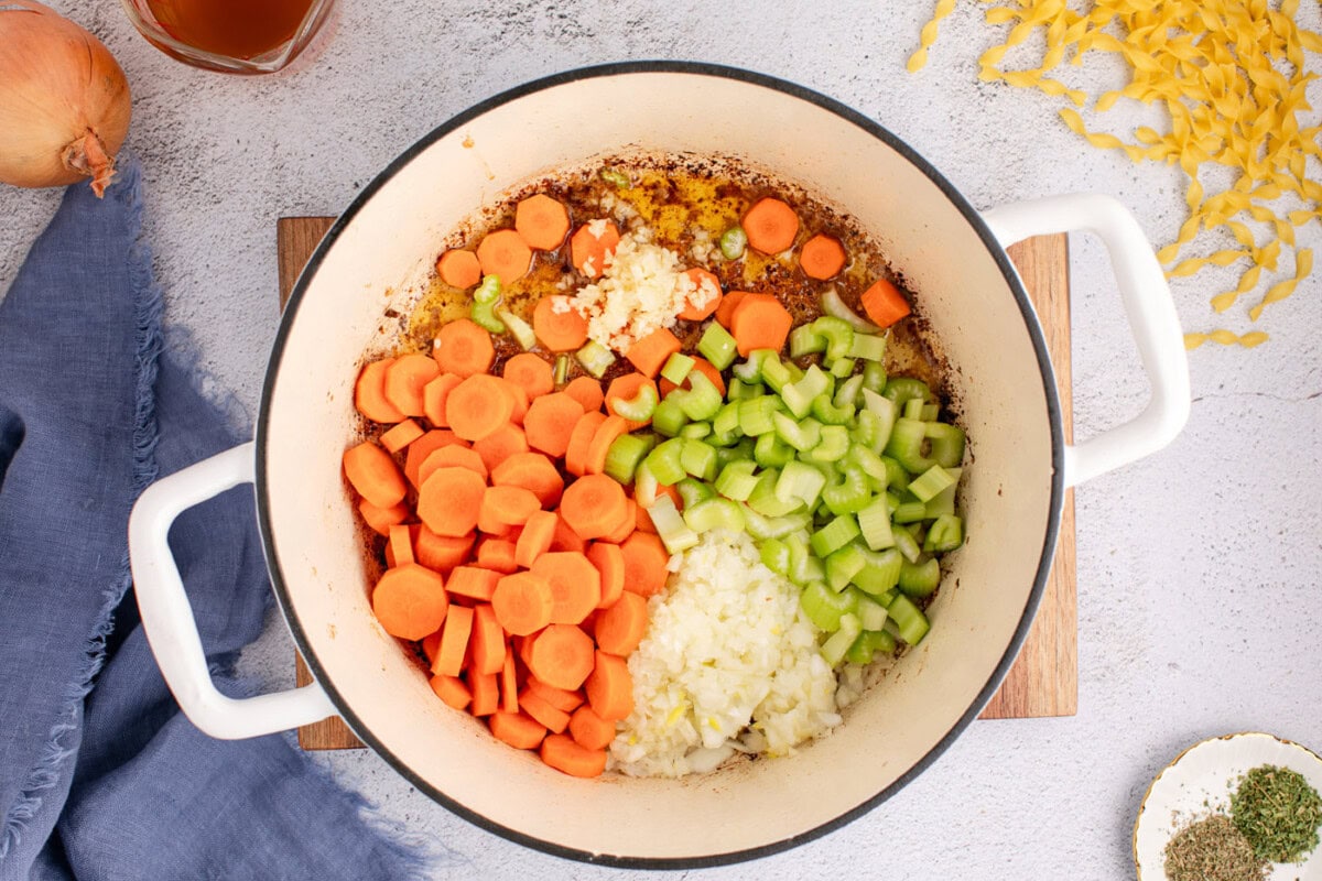 carrots, celery, onion, and garlic adding to pot
