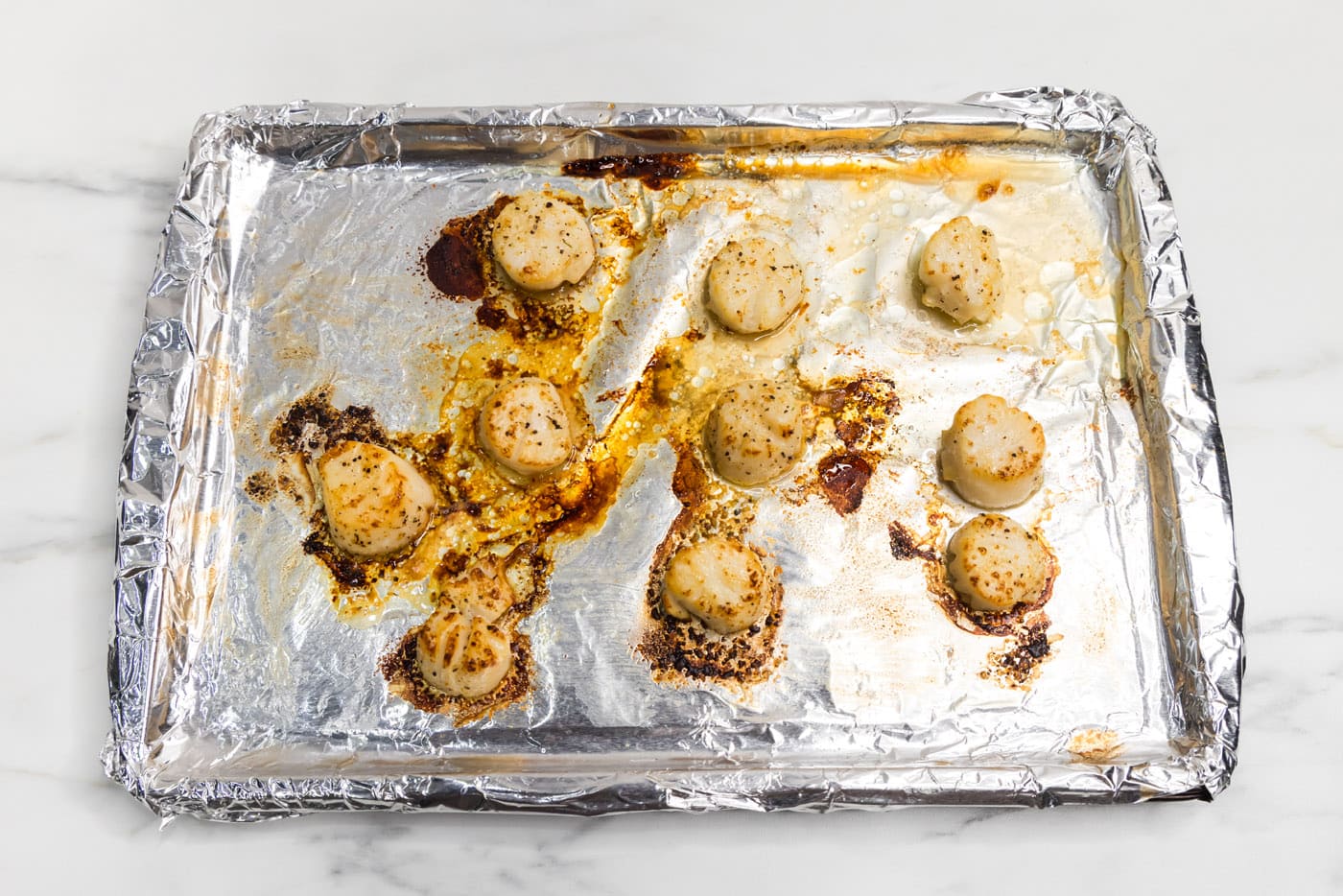 easy broiled scallops on a baking sheet