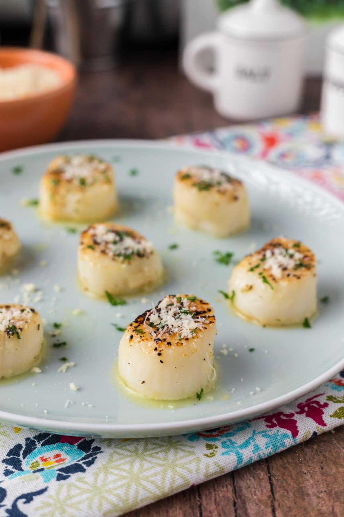 Side photo of Broiled Scallops on a plate