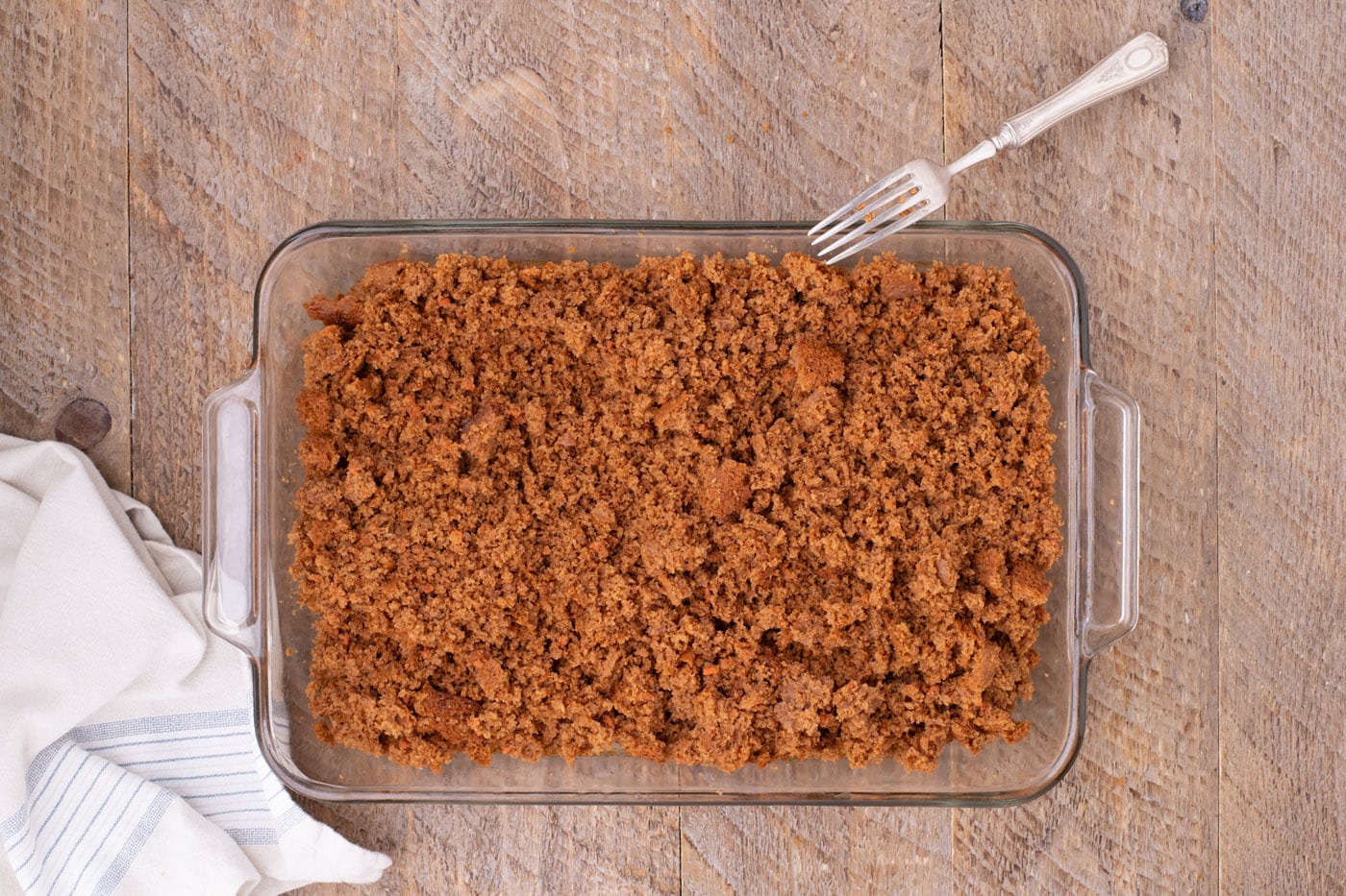 crumbled carrot cake in a pan