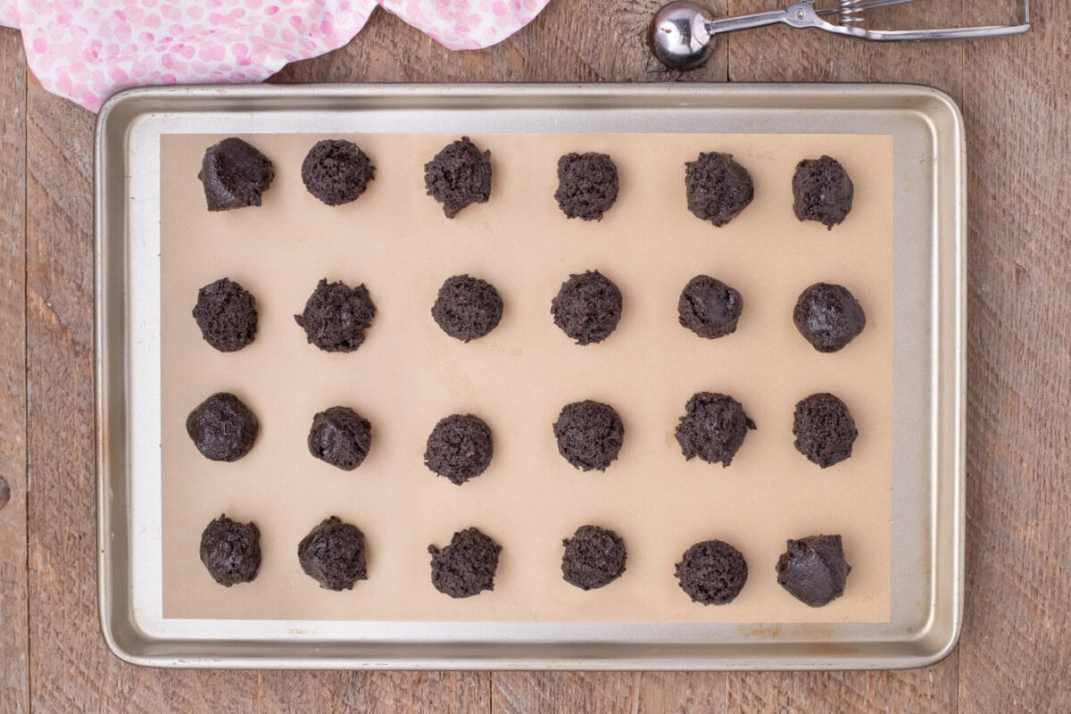 Oreo mixture scooped on a baking sheet