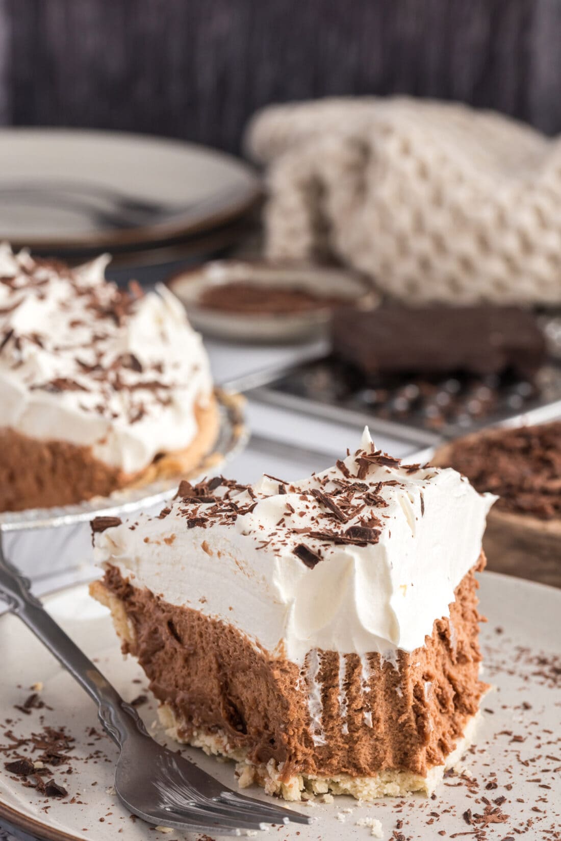 Slice of French Silk Pie on a plate with a bite removed