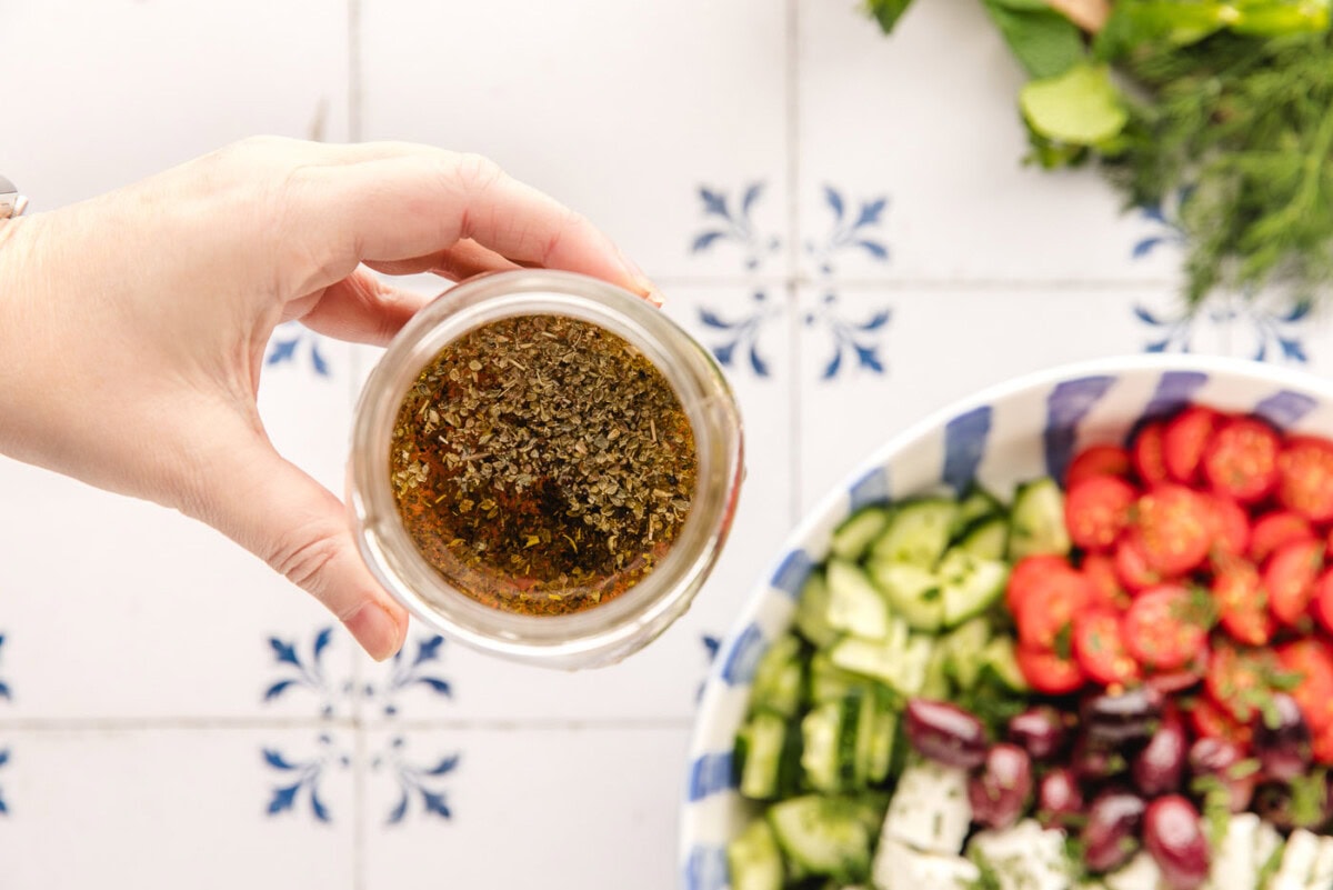 lemon, olive oil, and red wine vinegar salad dressing in a jar