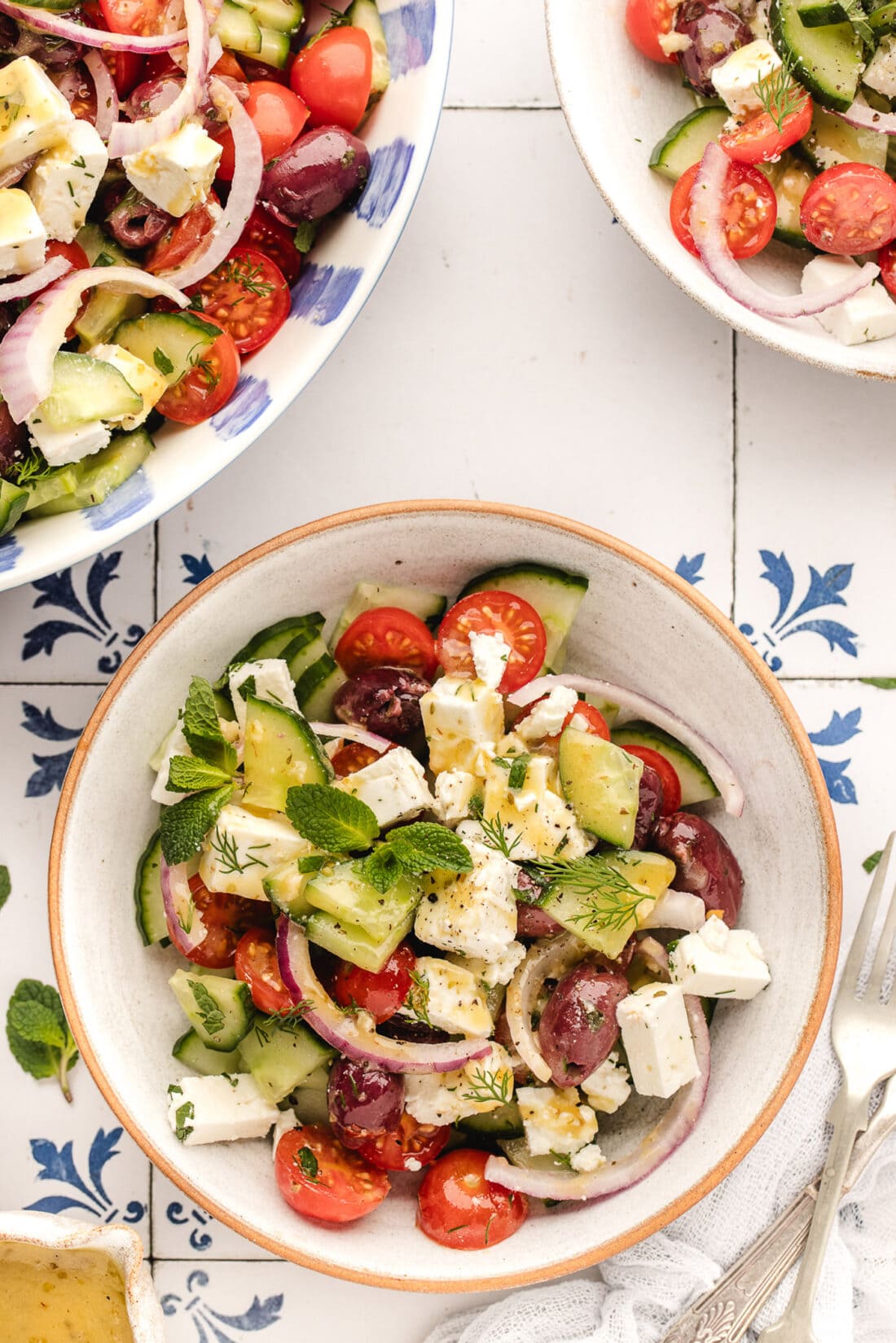 Three bowls of Greek Salad