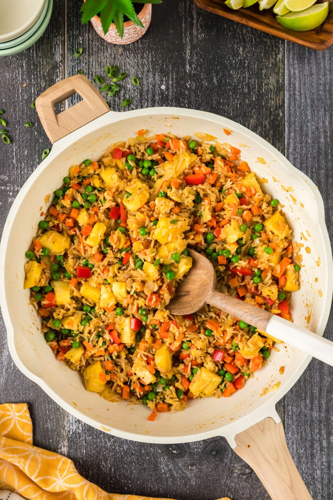 Pineapple Fried Rice in a skillet with a spoon
