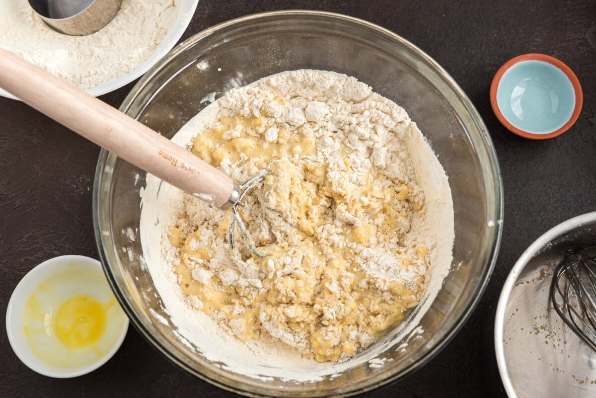 stirring flour into dough