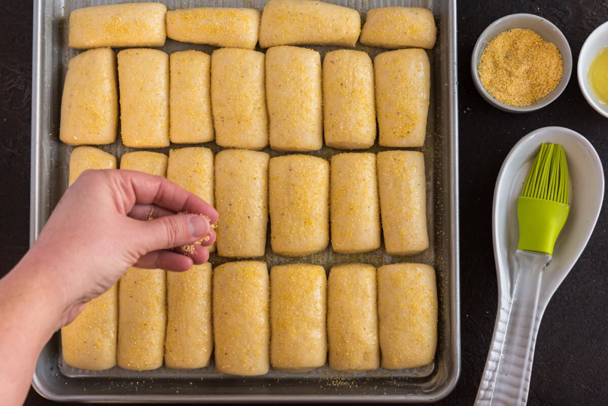 sprinkling dinner rolls with cornmeal