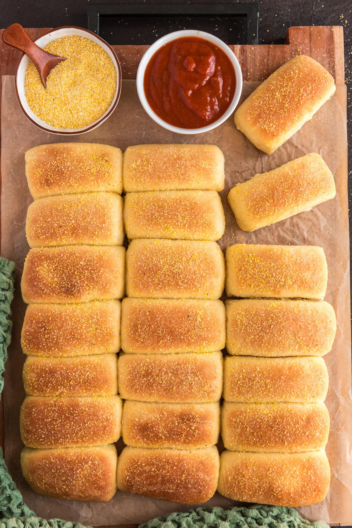 Pull Apart Cornmeal Dinner Rolls on a wooden board