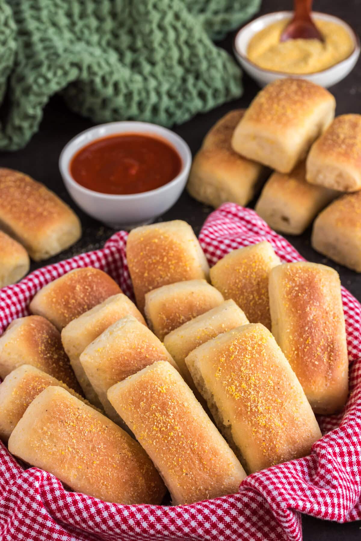 Pull Apart Cornmeal Dinner Rolls in a towel lined basket