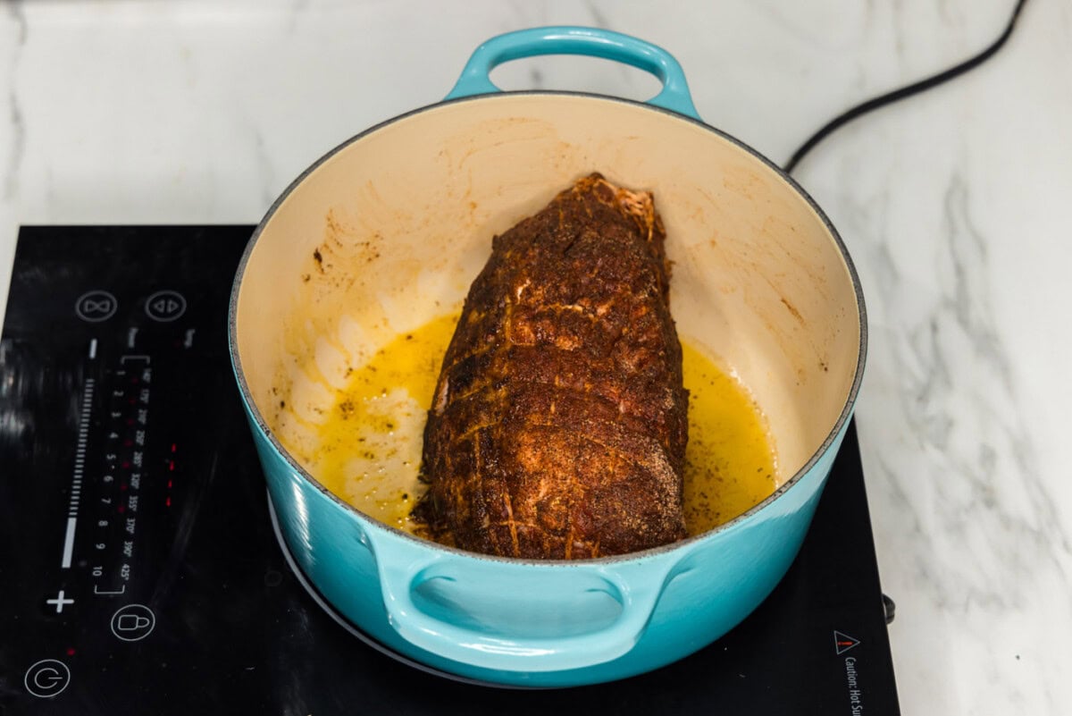searing pork shoulder in a dutch oven