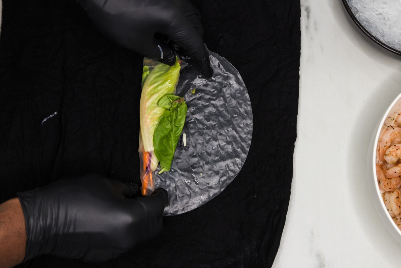 wrapping vegetables in a spring roll wrapper