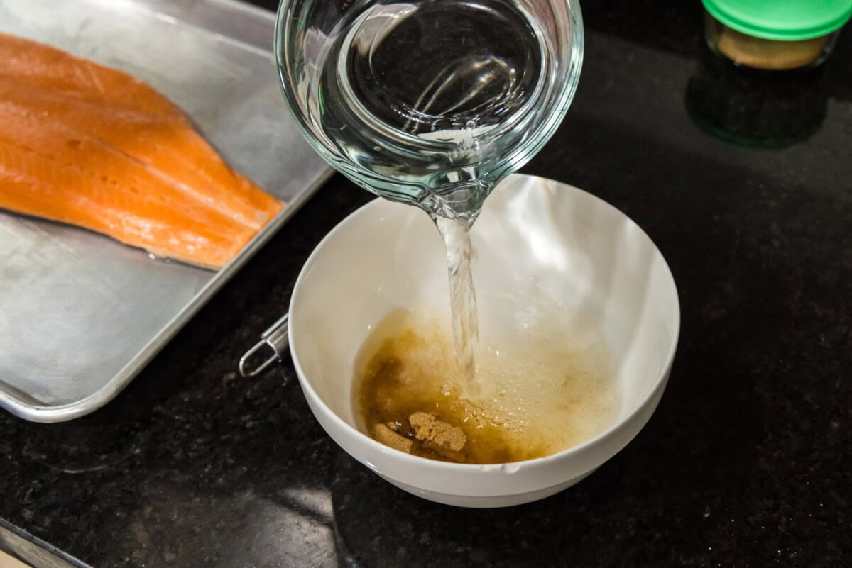 pouring water over brown sugar and salt