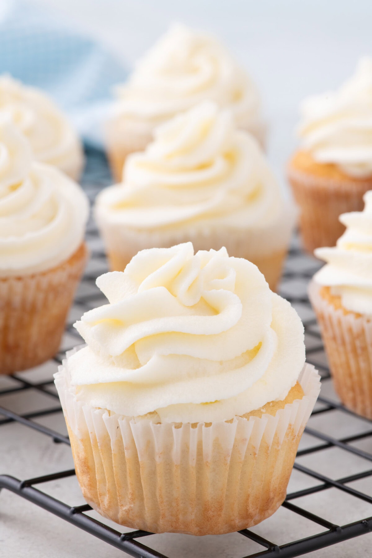 Vanilla Cupcakes on a a wire rack