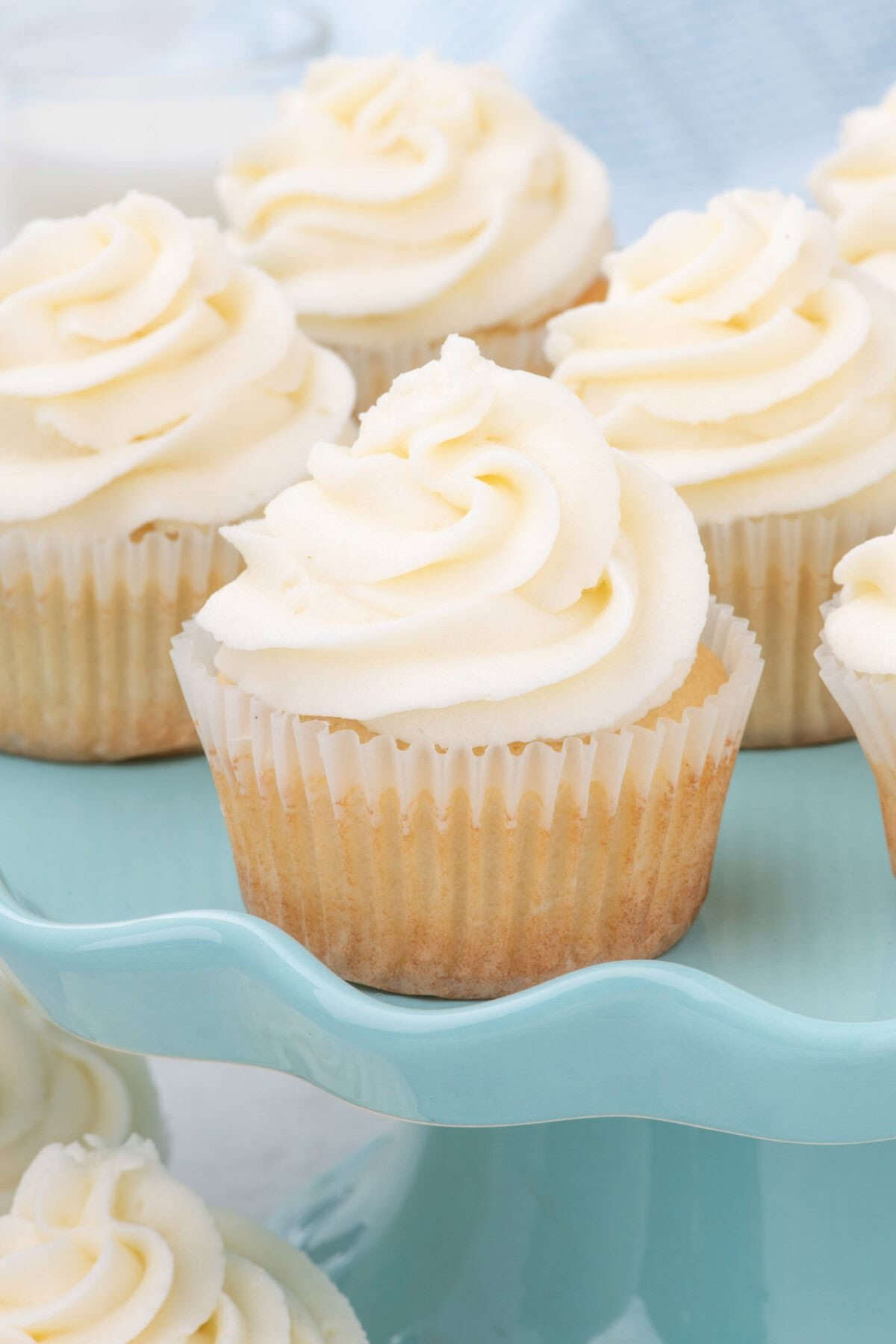 Vanilla Cupcakes on a blue cake stand