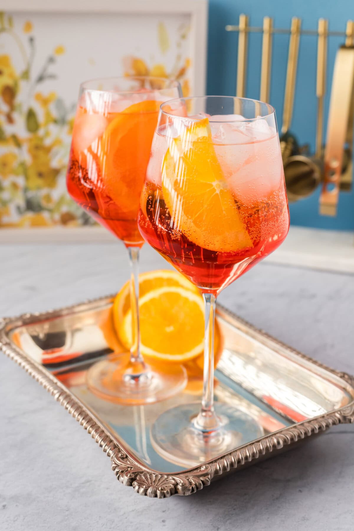 Two Aperol Spritz cocktails on a serving platter