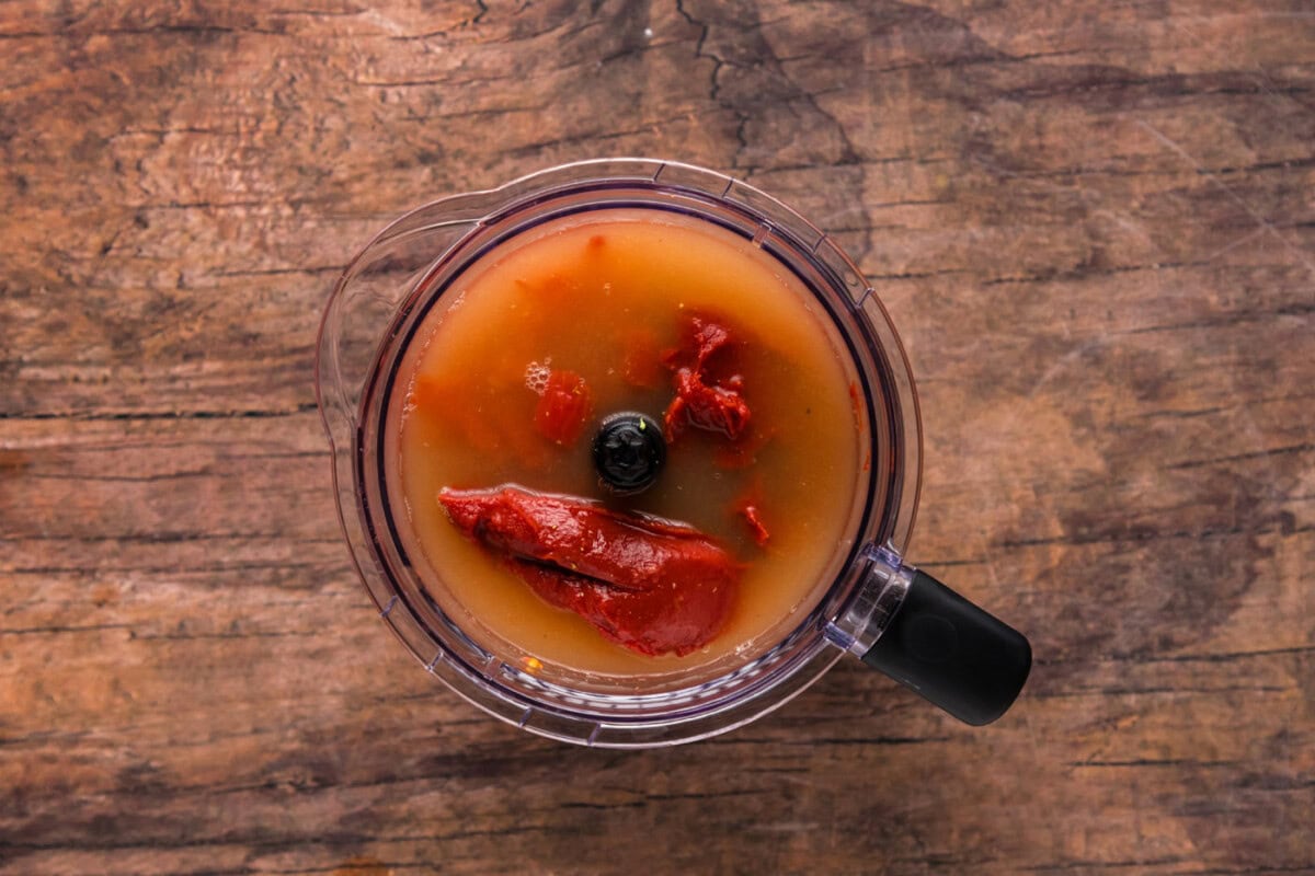tomatoes, tomato paste, and chicken broth in a blender