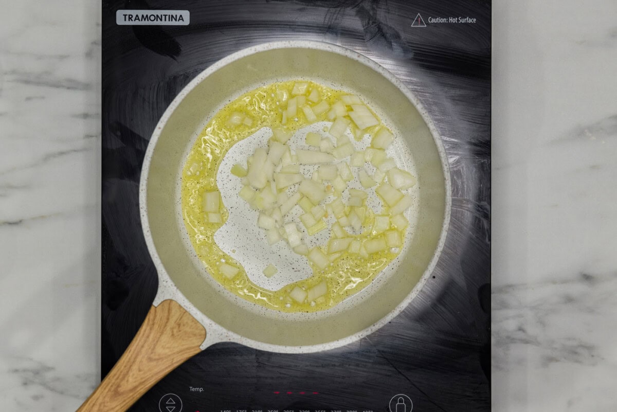 sauteeing onion in a skillet