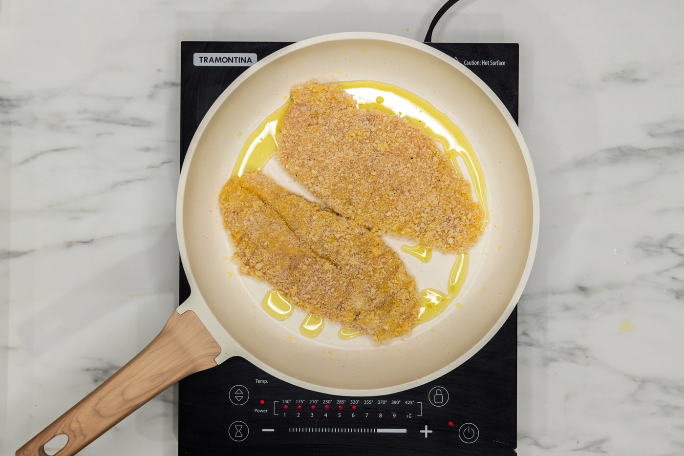 pan frying dredged chicken cutlet