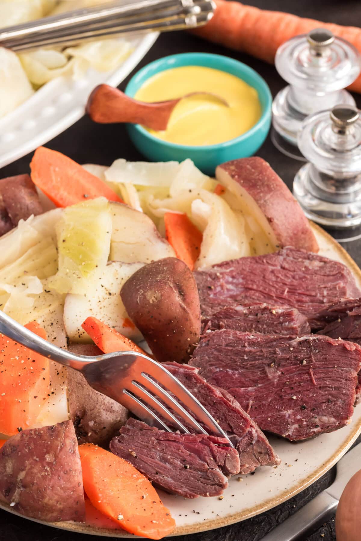 Fork breaking up a piece of Corned Beef