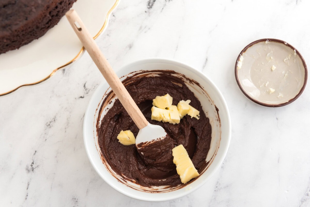 stirring butter into chocolate ganache