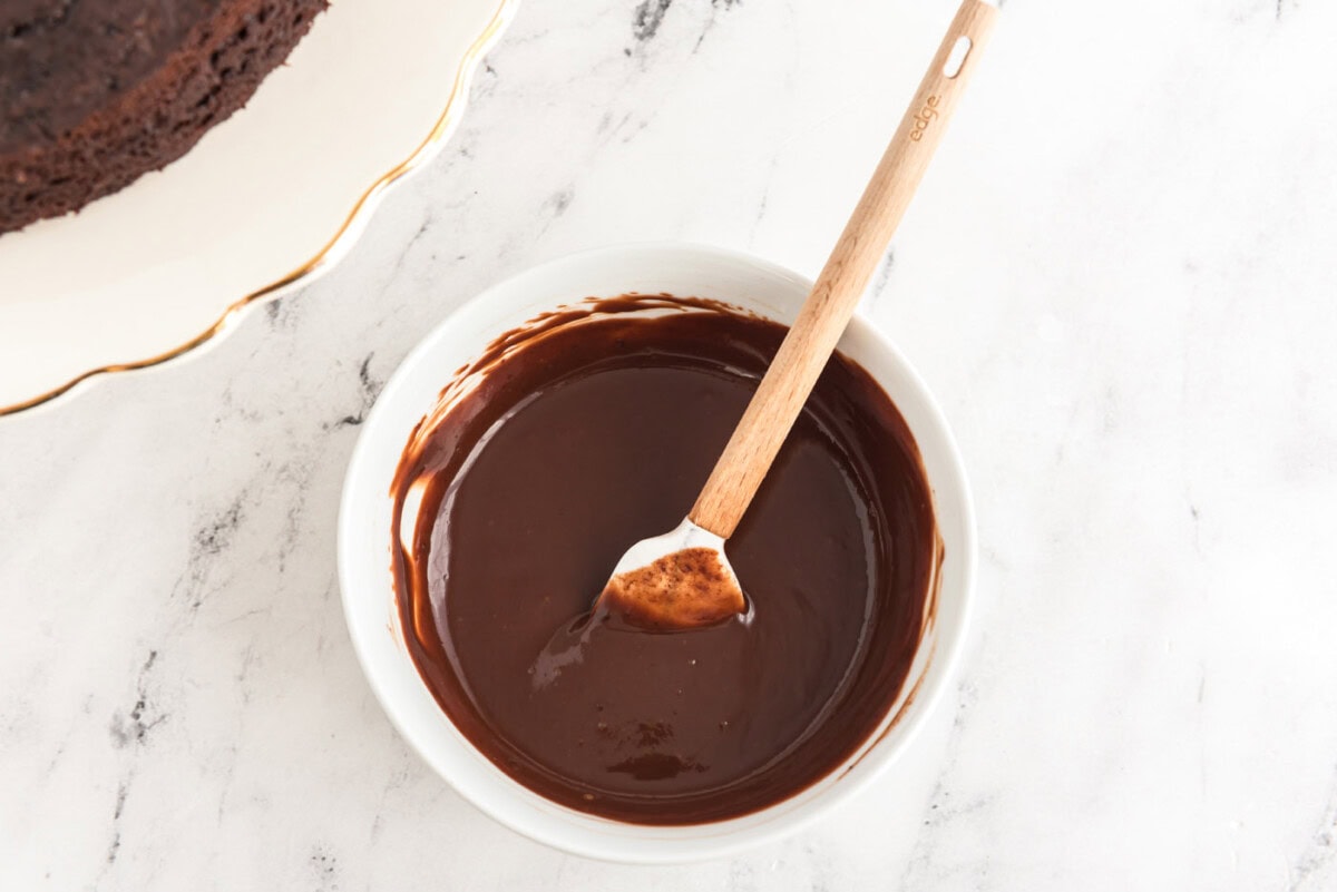 easy chocolate ganache in a bowl with a spatula