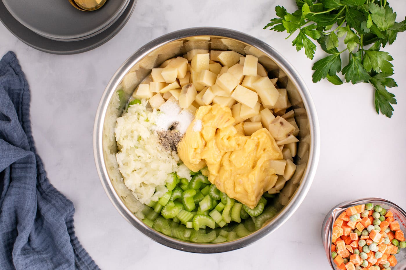 potatoes, celery, cream of chicken, chicken broth, and whole milk in instant pot with chicken
