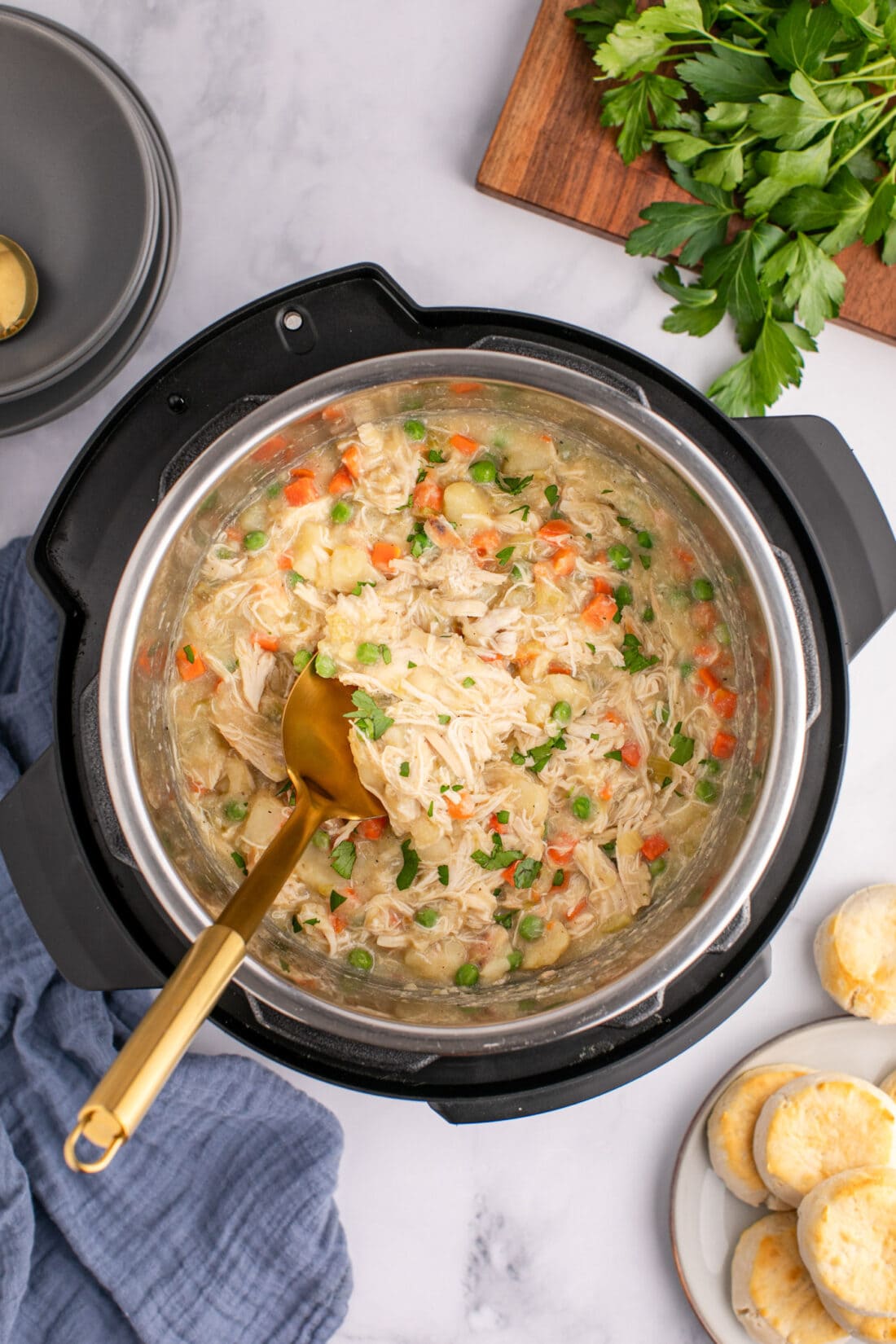 Instant Pot Chicken Pot Pie with a serving spoon in it