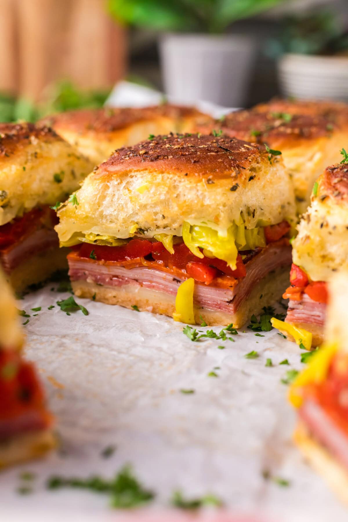 Close up photo of Italian Sliders on parchment paper