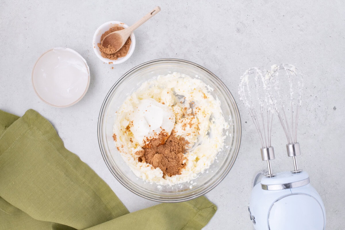 sour cream, taco seasoning, and cream cheese in a mixing bowl