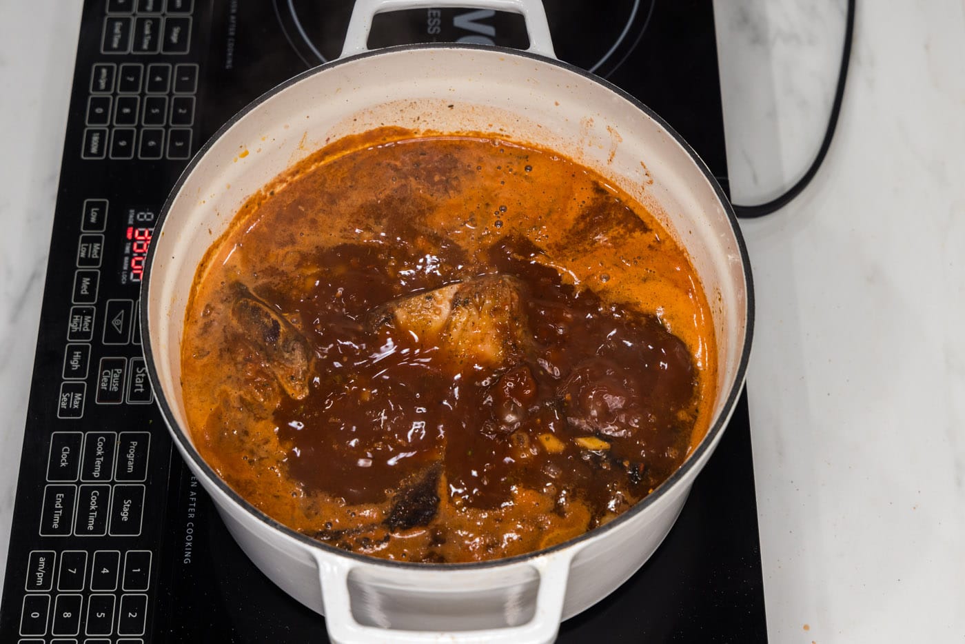braised Mexican beef short ribs in a dutch oven