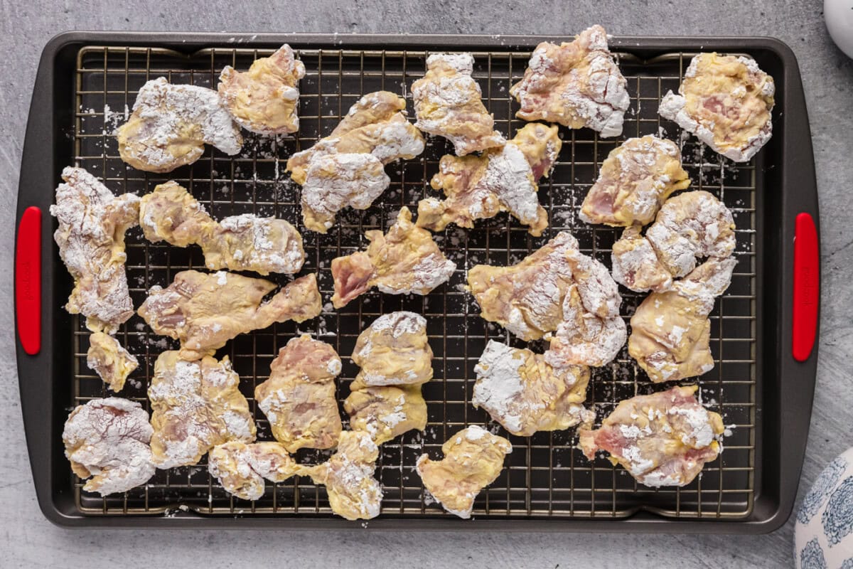 dreded chicken pieces on a wire rack