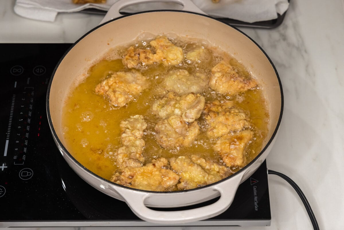 chicken frying in oil