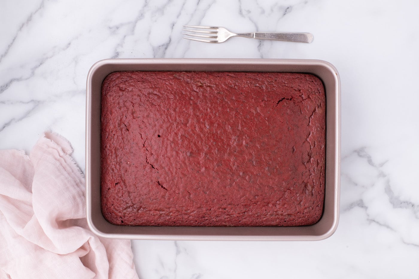 baked red velvet cake in a pan